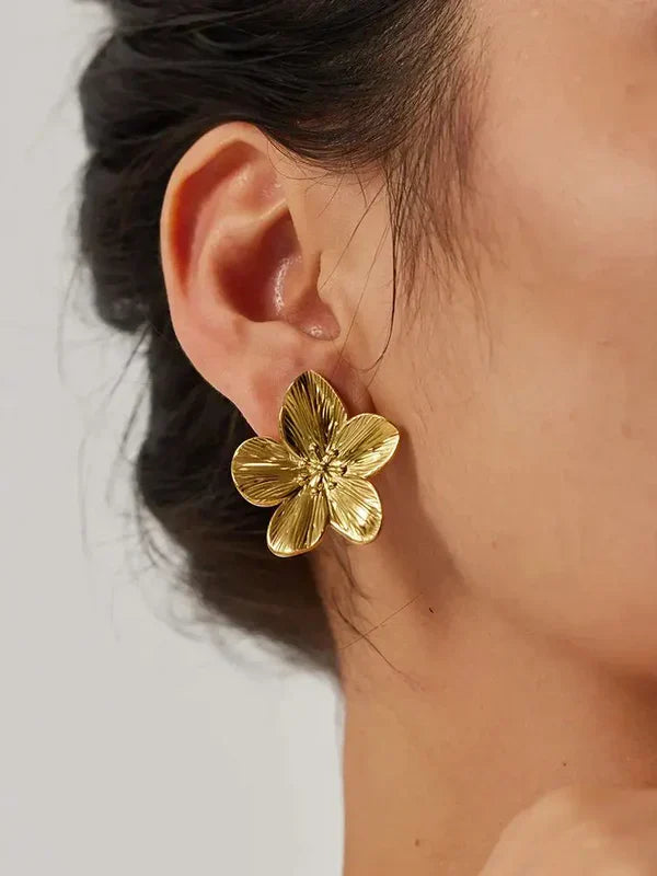 A model wearing Opulent Earrings, highlighting their sophisticated elegance.