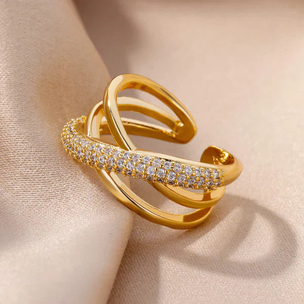 Elegant gold ring displayed on a velvet stand