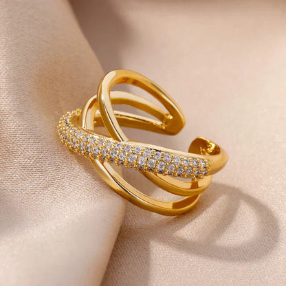 Elegant gold ring displayed on a velvet stand