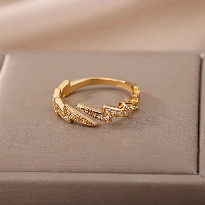 Gold-tone Énergie Ring with lightning bolt and crystal accents