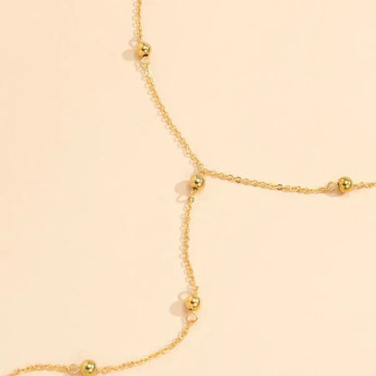 Minimalist 18K gold Éthéral Necklace, ideal for layering or wearing solo